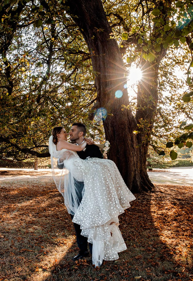 Fun bride and groom at sunset