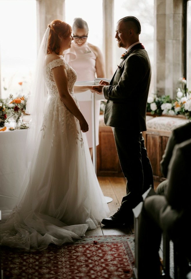 Jennifer Patrice, an experienced Independent Celebrant, with a happy couple on their wedding day, delivering an authentic, joyful, and personalised ceremony in a beautiful setting.
