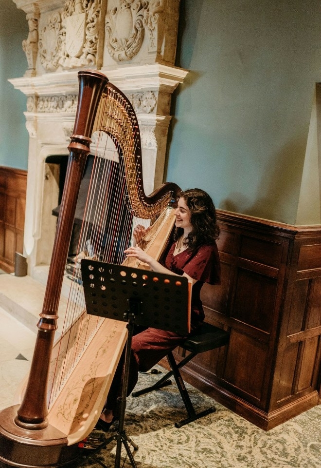 Playing some beautiful harp music for guests at Horwood House 