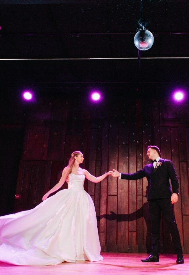 Bride and Groom on Dancefloor under Sparkling Glitterball