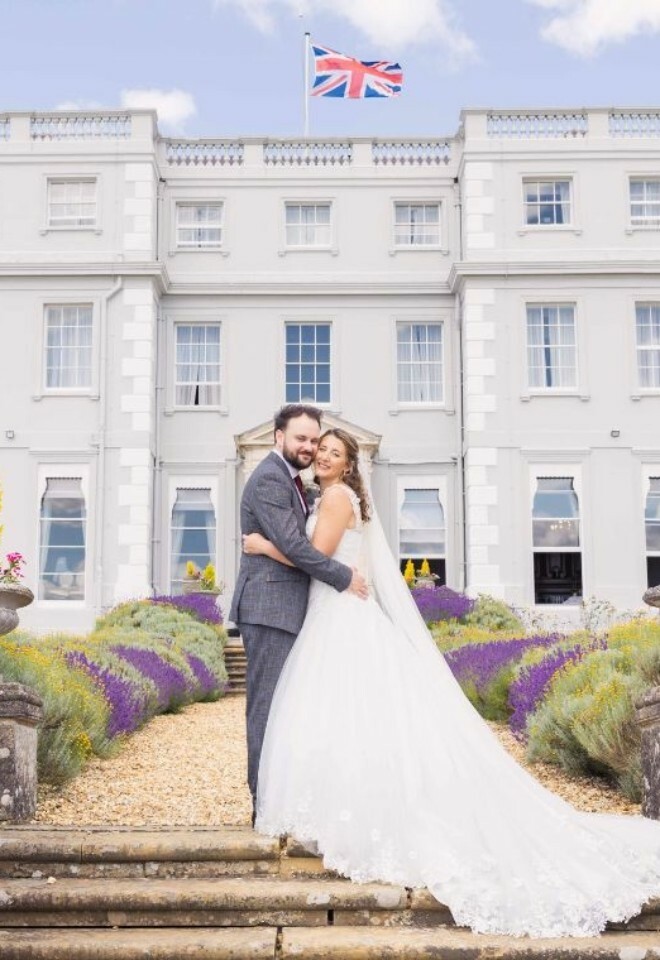 A couple stood on the steps at the back of the Mansion House.