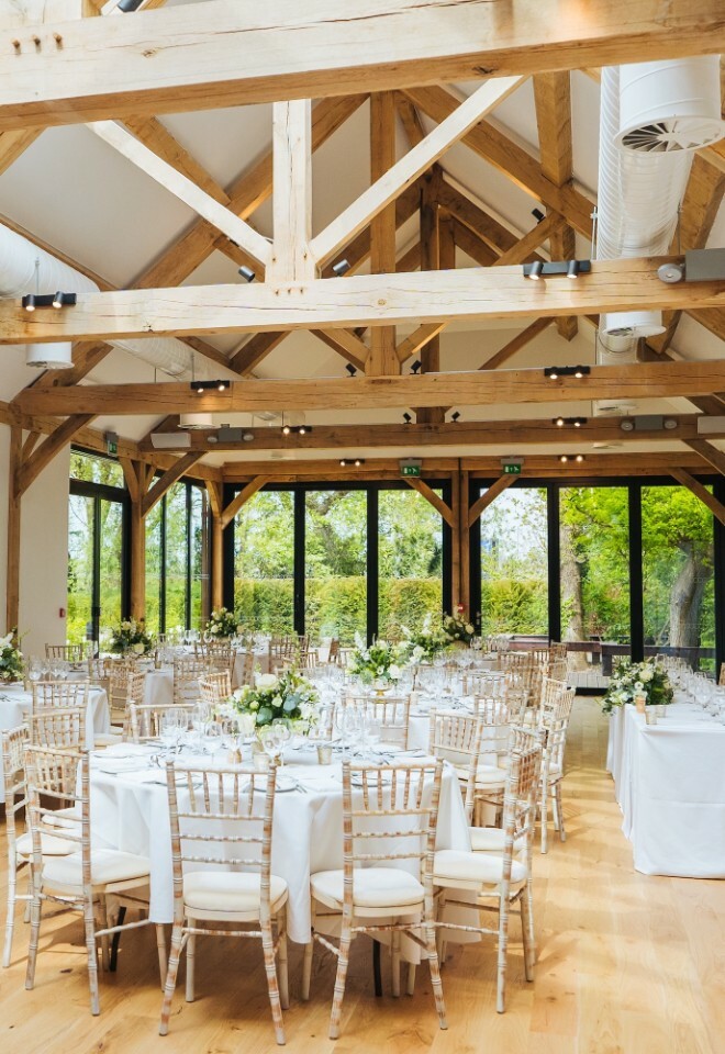 Wedding barn set for the meal during wedding reception