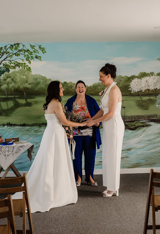 Two brides and the celebrant