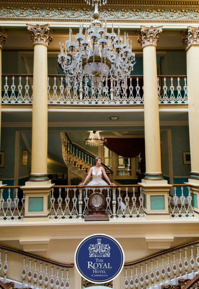 Bride standing by the grand staircase