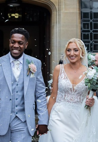 Wedding couple confetti throwing outside of Putteridge Bury wedding venue