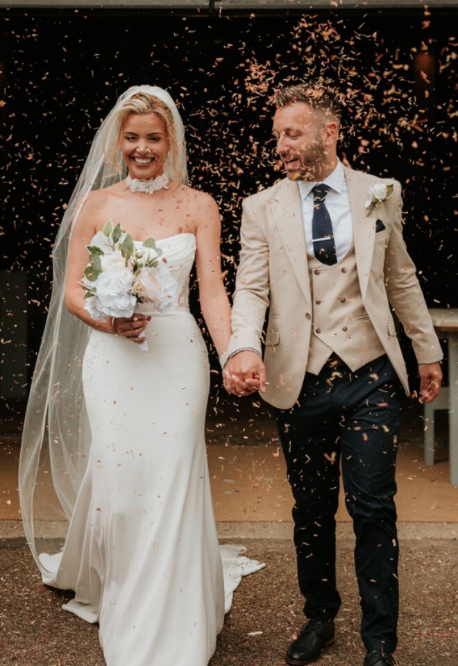 happy-couple-milling-barn