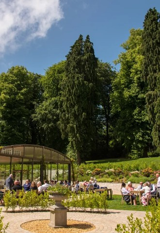 Guest enjoying the sun outside Coed Y Mwstwr Hotel, Bridgend, South Wales