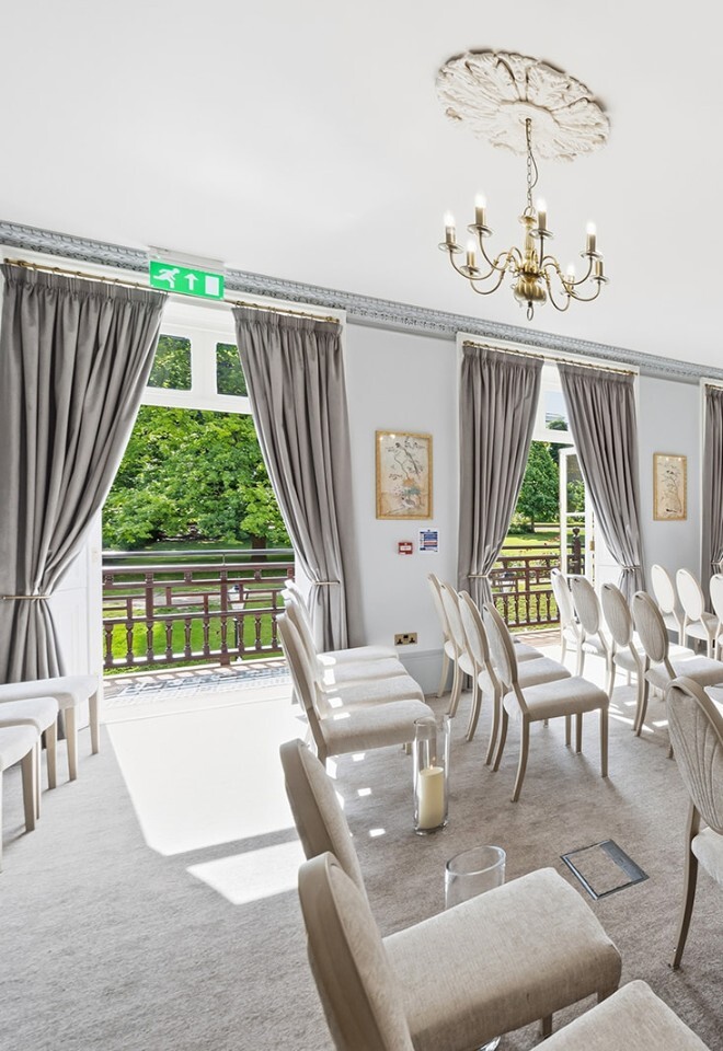 The Sunne Room at The Commissioners House set up for an indoor ceremony with opened french doors