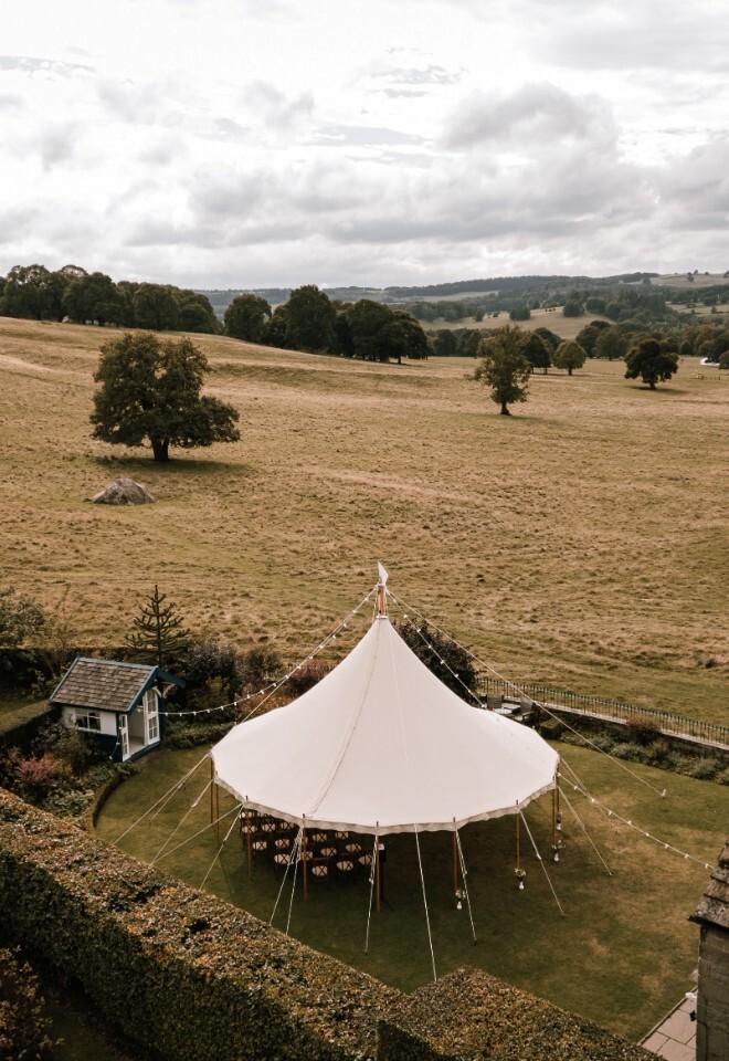 Outdoor wedding ceremony tipi overlooking the Chatsworth Estate in Derbyshire