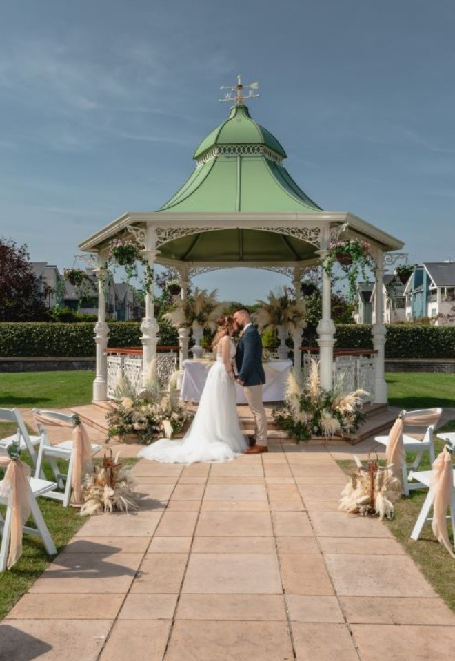 Couple by Gazebo set for Ceremony