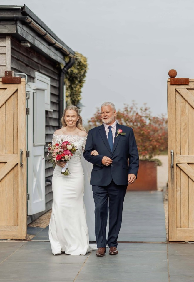 Father of the bride, walking the bride through the gates at Southend Barns, Chichester, Sussex