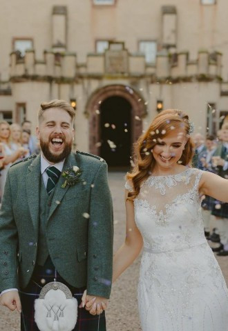 Bride and groom showered in confetti at Fyvie Castle, Aberdeenshire