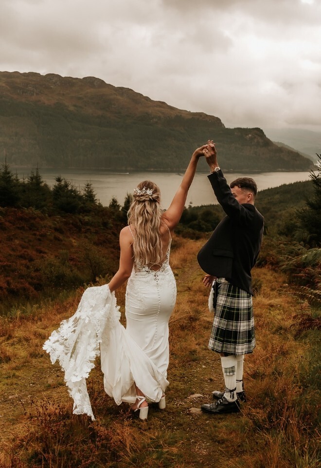 Bride and groom dance next to the Loch at Carrick Castle Estate