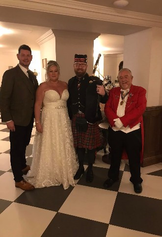 Scottish bagpiper with bride & groom & trevor english toastmaster