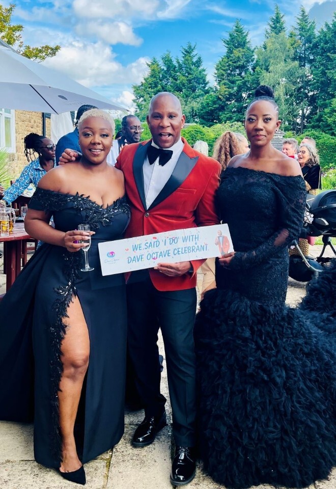 Dave Octave Celebrant with a happy brides smiling and holding my We said I Do with Dave Octave Celebrant sign.