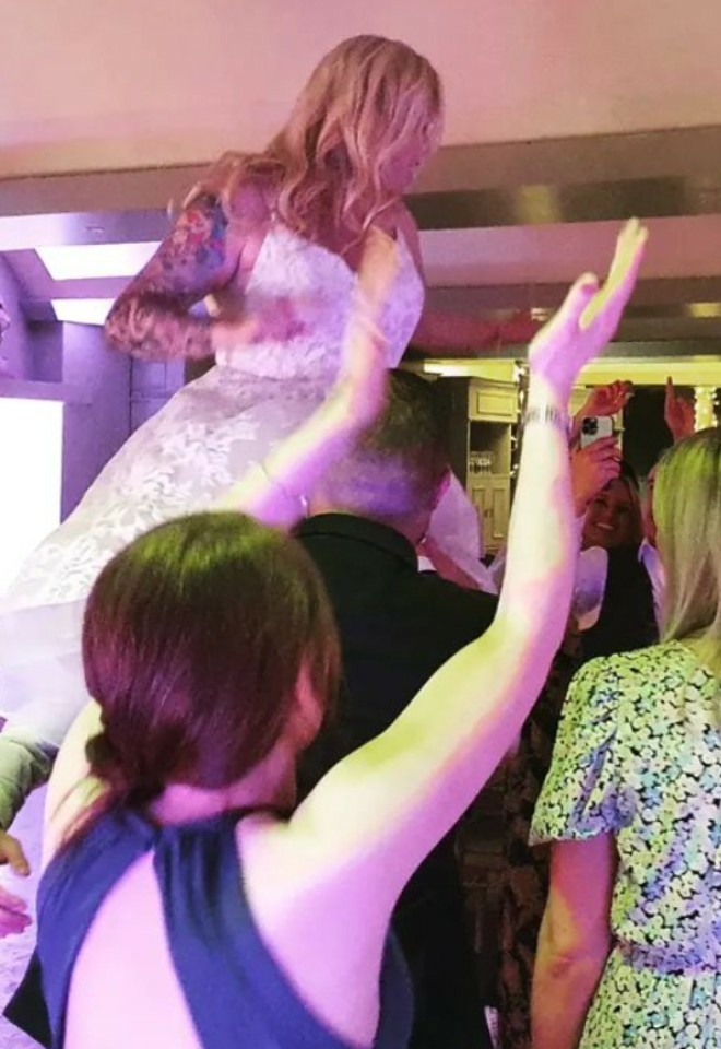Bride having fun at her evening reception with music supplied by Danny Costello DJ from DJ2K