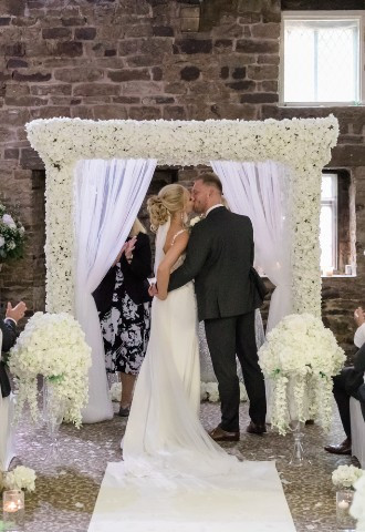 Bride and groom share their first kiss at Mosborough Hall Hotel, Yorkshire
