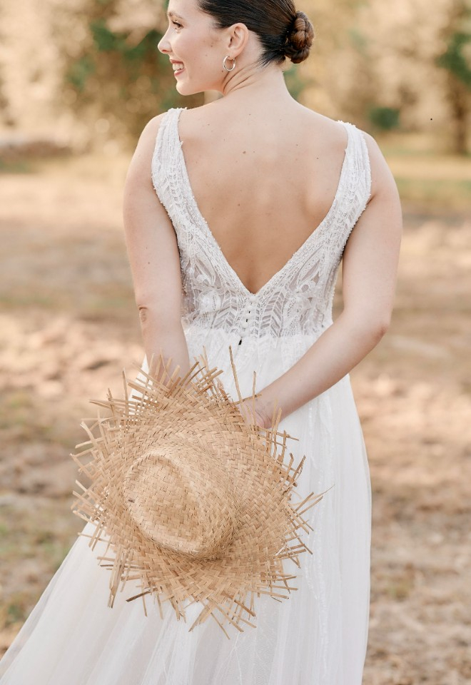 Mallorca wedding Bride with hat in Olive Groves at Sa Casa Bona by Stuart Wood
