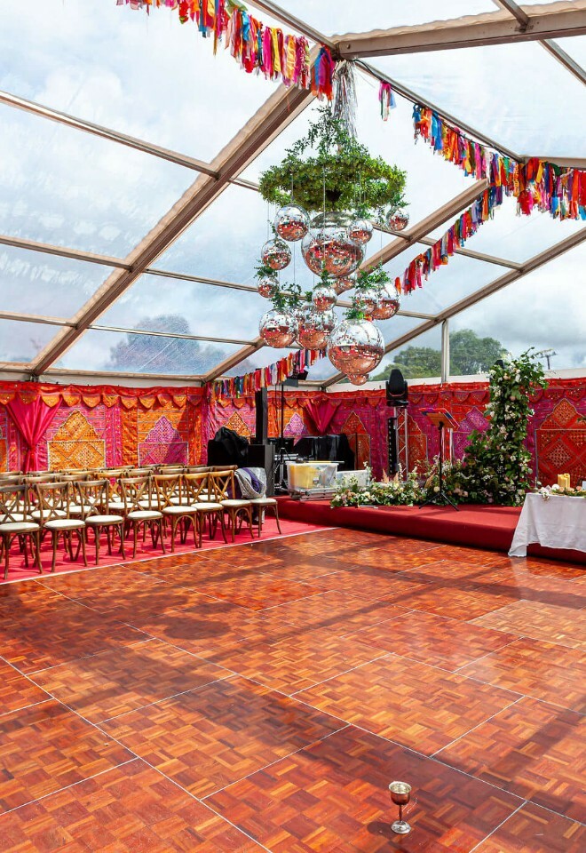 Multicoloured tassle hanging in a clearspan marquee with bombay boudoir wall linings