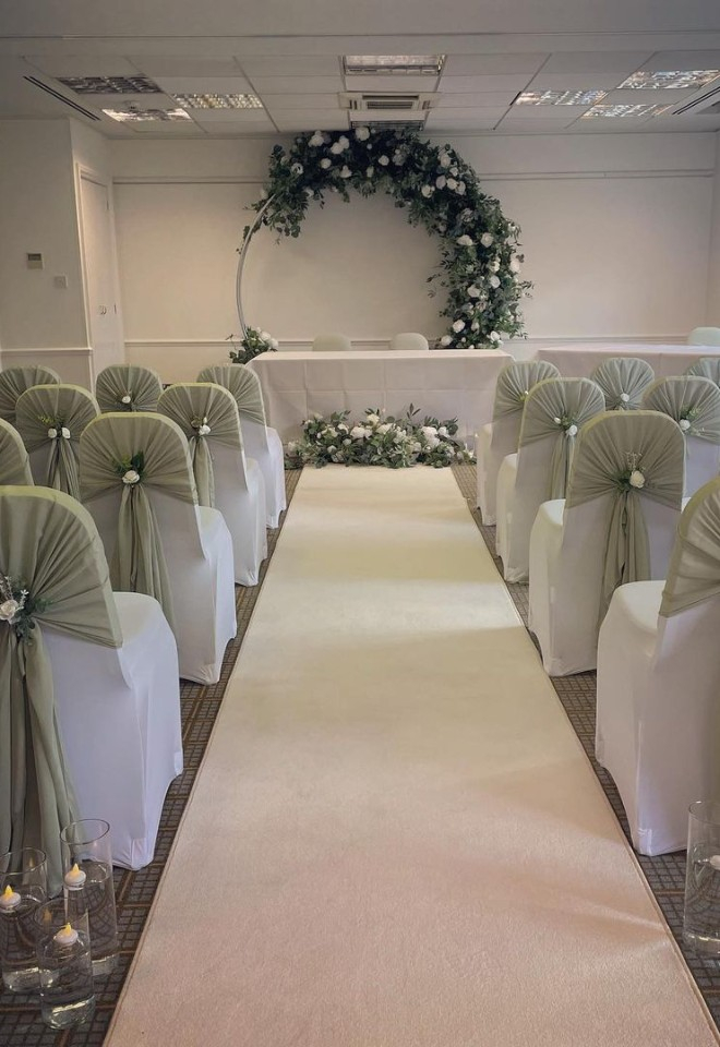 Green and white wedding ceremony set up at Holiday Inn Colchester