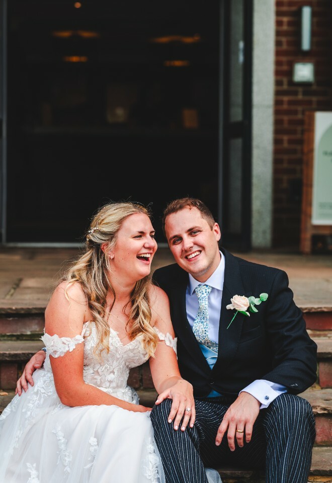 bride and groom on steps