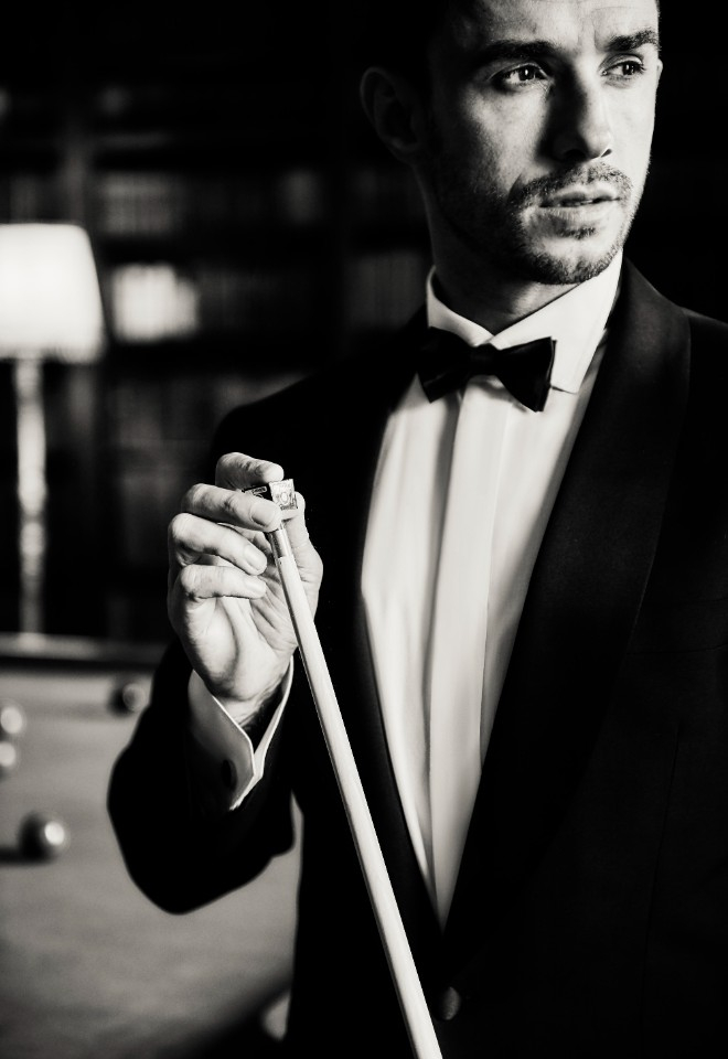 Groom playing snooker at Hopetoun House wedding by Stuart Wood