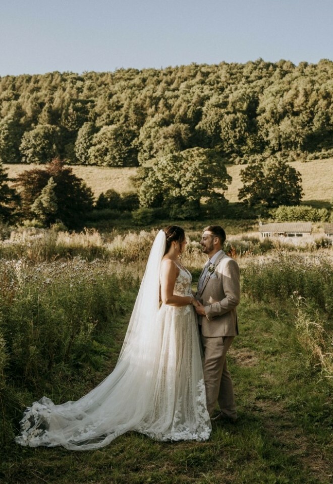 Couple standing in front of the views surrounding the venue