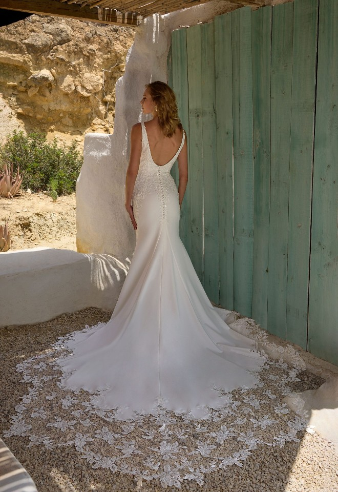 Bride wearing dress from Broomvale Bridal Barns designed by Mark Lesley