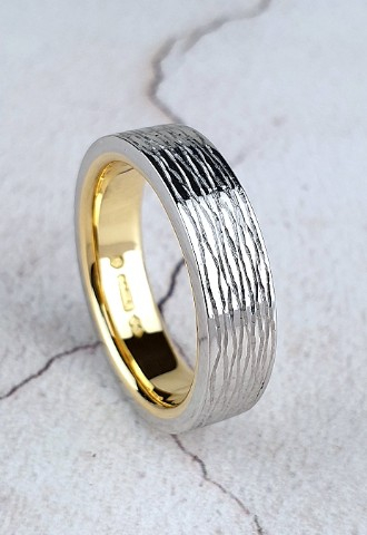 Bespoke platinum wedding ring with gold inside