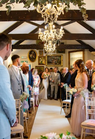 Converted Barn Wedding ceremony at at Widbrook Grange - a dog-friendly wedding venue in Wiltshire