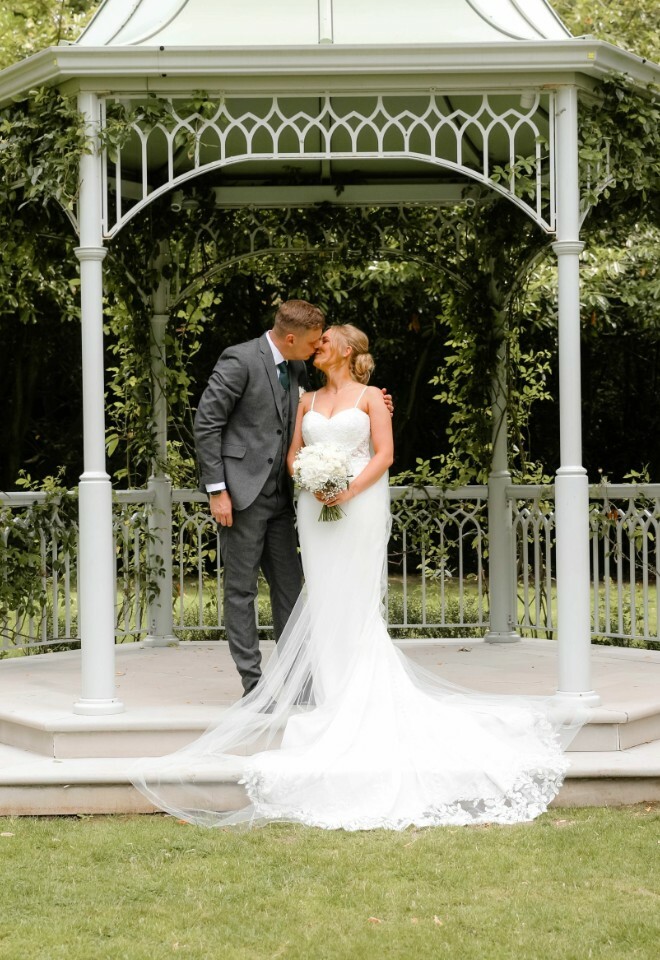 Couple kissing under the gazebo
