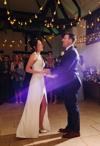 Bride and groom share their first dance at Nether Winchendon Carriage Barn