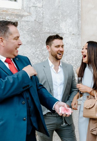 Wedding guests enjoying magic by Richard Parsons, Gloucestershire Magician