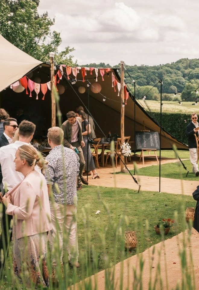 Stretch tent in countryside setting for wedding reception