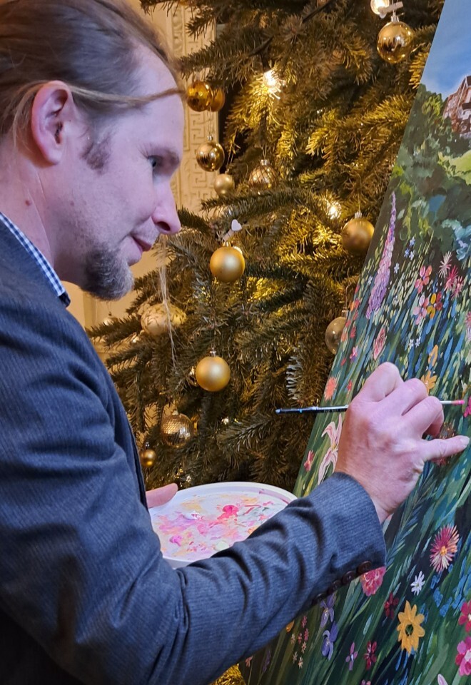 guest painting at wedding