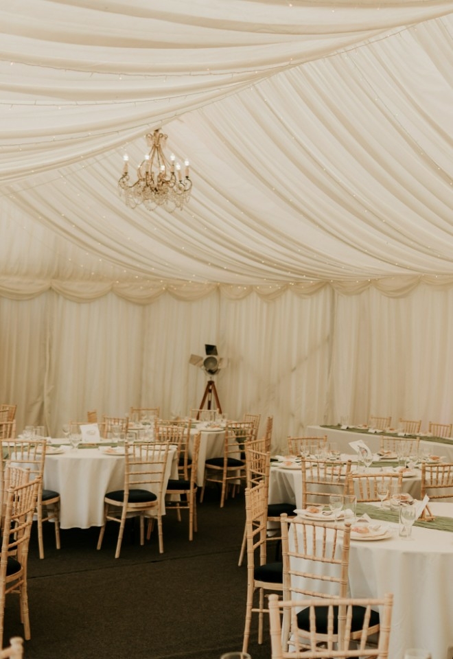 Wedding breakfast in the marquee at Monkton Barn wedding venue near Marlow