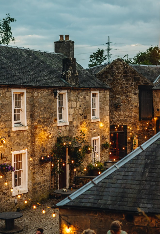The outdoor courtyard with festoon lights at Folkerton Mill.  Photo: Paul Budzinski