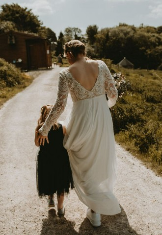 Bride and flower girl outside wedding Yorkshire