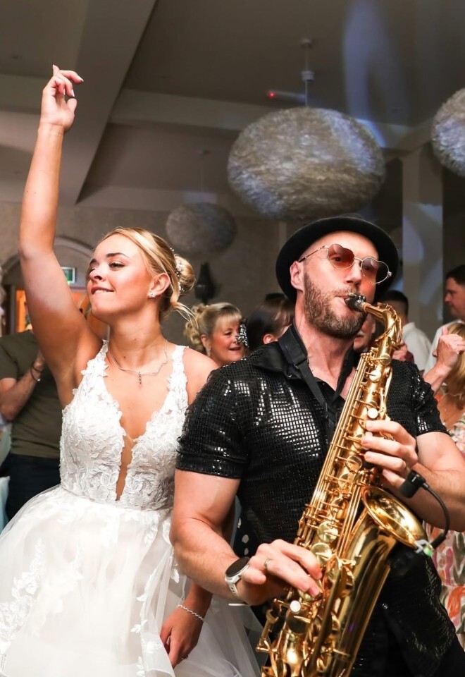 Wennington Hall wedding, dance floor of bride dancing to the saxophone player