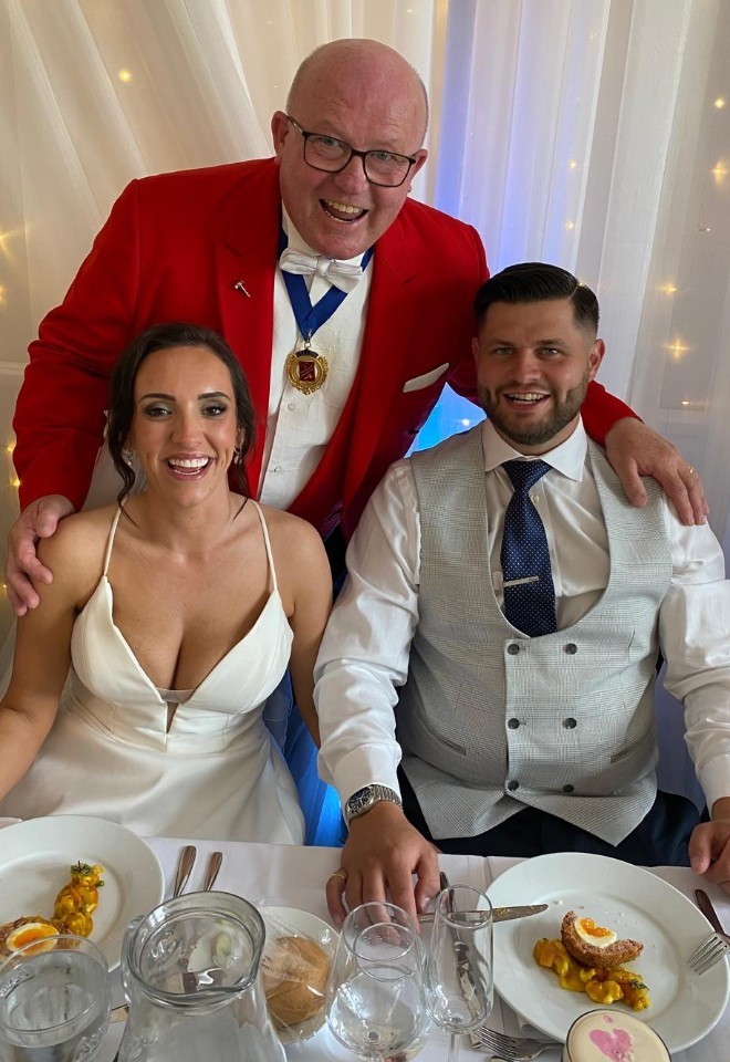 Surrey wedding toastmaster and celebrant Toastmaster John sharing a fun moment with the newlyweds during their wedding breakfast.