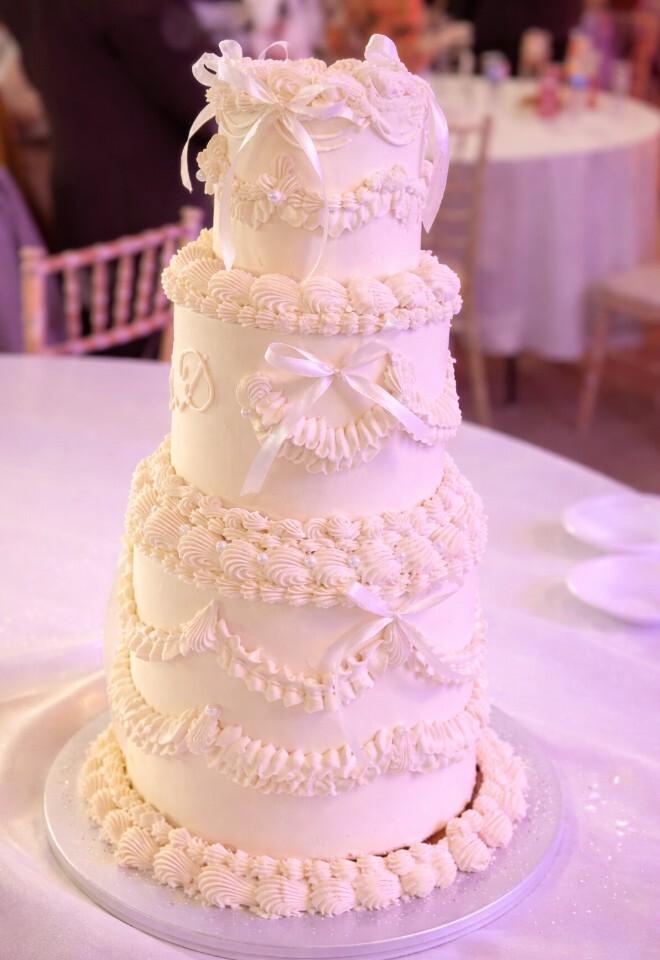 Wedding cake display at Briar House Barns barn wedding venue in Rotherfield, East Sussex