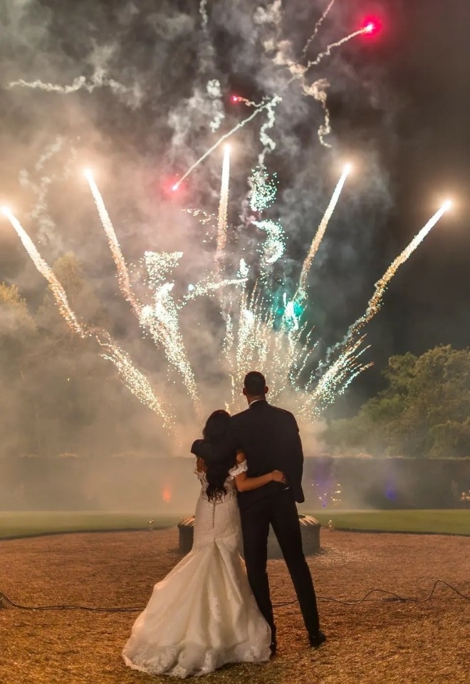 Bride and groom watching fireworks at Elmhay Park