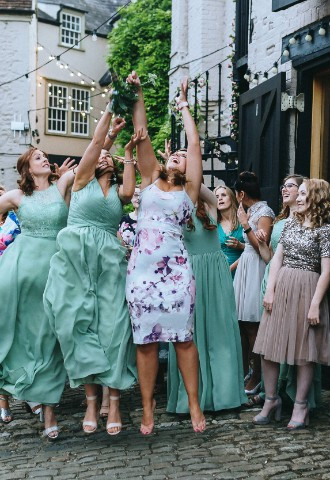 Bouquet toss at wedding - Crown and Thistle