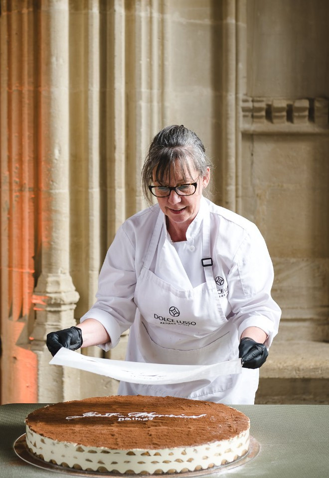 Oxfordshire-based Dolce Lusso Cakes preparing a traditional Italian Tiramisu wedding cake, assembled live at the wedding for guests to enjoy.