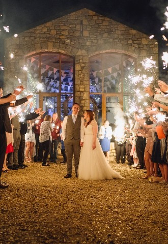 Bride and groom being surrounded by sparklers at their Rosedew Farm wedding, Vale of Glamorgan