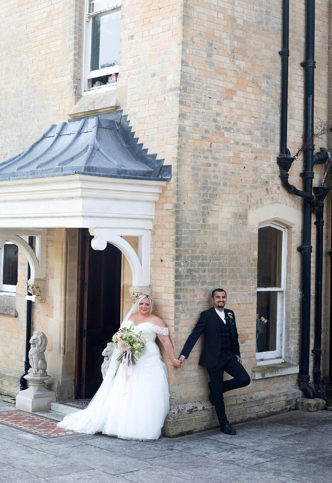 “Bride and groom outside Radipole Manor Weymouth Dorset wedding venue entrance”