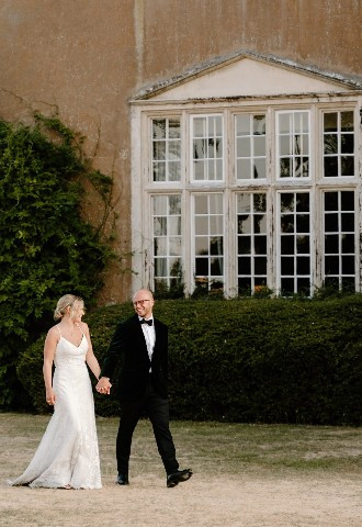 Bride and groom exploring the grounds at Bisham Abbey, Berkshire