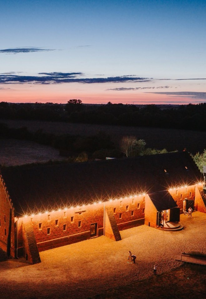Night time drone shot of Copdock Hall in Suffolk