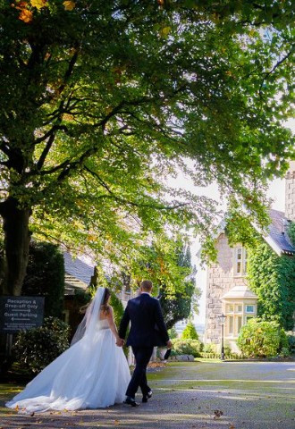 Bride and Groom walking in West Tower Wedding Venue