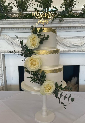 Three tier lemon wedding cake with lemon roses and gold trim and Mr and Mrs Cake Topper made by Celebration Cakes by Catherine Scott in Berkshire